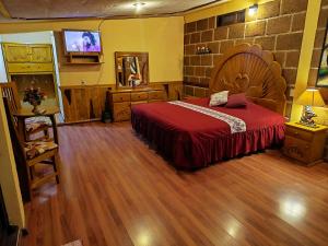 Postel nebo postele na pokoji v ubytování Hotel campestre la cabaña