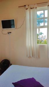 TV a/nebo společenská místnost v ubytování Code In Hospedaria