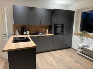 Køkken eller tekøkken på Ferienhäuser Wintermoor