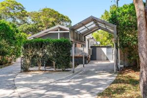 a house with a gate and a garage at Iluka Sea Spray in Iluka