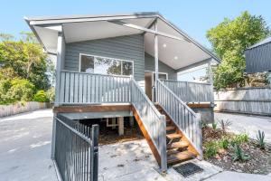 a house with a staircase leading up to it at Iluka Sea Spray in Iluka