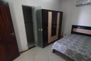 En eller flere senge i et værelse på Vila Manu