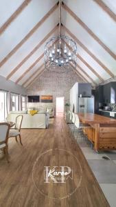 a living room with a table and a dining room at Die Karoo Patriot in Orania