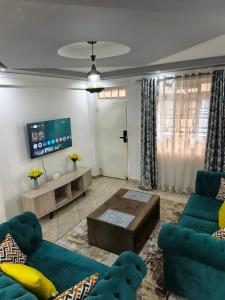 Μια τηλεόραση ή/και κέντρο ψυχαγωγίας στο The pine 2 bedroom house California plaza +5 φωτογραφίες