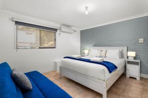 En eller flere senge i et værelse på Rubys Place on Banksia