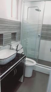a bathroom with a sink and a toilet and a shower at Avana Hills Boracay Prime Traveler's Suite 302 in Boracay +28 photos
