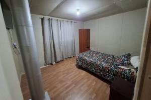 Una cama o camas en una habitación de Ester Alojamiento