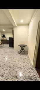 a room with a table in the middle of a room at TUYU Chhye in Kathmandu