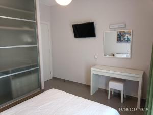 TV a/nebo společenská místnost v ubytování Villa Eos