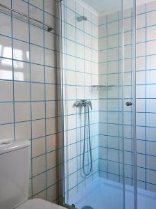 a bathroom with a shower and a toilet at Casa da Princesa in Vila Real de Santo António