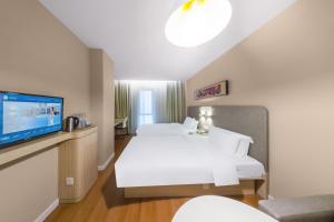 Μια τηλεόραση ή/και κέντρο ψυχαγωγίας στο Hanting Hotel Shanghai Songjiang Sheshan