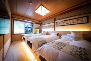 Un pat sau paturi într-o cameră la Ohanabo