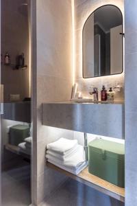 a bathroom with a sink and a mirror and towels at Panorama Kakheti Resort in Gurjaani +72 photos