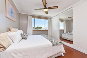 Ένα ή περισσότερα κρεβάτια σε δωμάτιο στο Wangi Point Escape