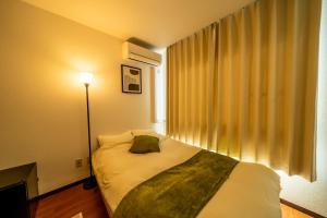 Ένα ή περισσότερα κρεβάτια σε δωμάτιο στο Casa G,S, - Vacation STAY 52837v +16 φωτογραφίες