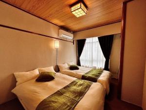 Ένα ή περισσότερα κρεβάτια σε δωμάτιο στο Casa G,S, - Vacation STAY 39501v +26 φωτογραφίες