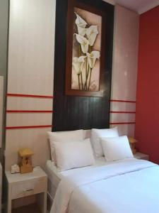 Ένα ή περισσότερα κρεβάτια σε δωμάτιο στο Umah kampung8