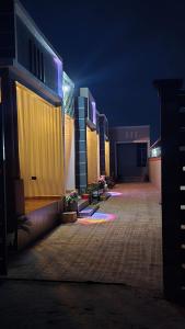 a night view of a building with lights on at Royal Katavi Villa 