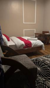 a room with two beds and a table at Royal Katavi Villa 