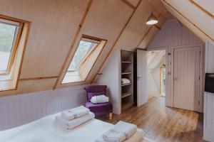 En eller flere senge i et værelse på Lodge 19