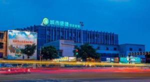 a large building with a sign on top of it at City Comfort Inn Liuzhou High-speed Railway Station Entrance in Liuzhou
