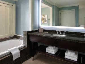 a bathroom with a tub and a sink and a mirror at The Westin Kāʻanapali Ocean Resort Villas- Island View STUDIO VILLA in Lahaina