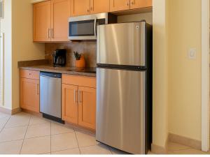 a kitchen with a stainless steel refrigerator and a microwave at The Westin Kāʻanapali Ocean Resort Villas- Island View STUDIO VILLA in Lahaina