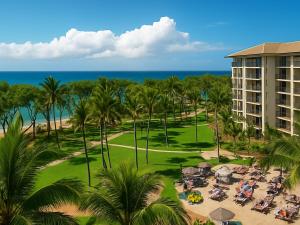 an aerial view of a resort with palm trees and the ocean at The Westin Kāʻanapali Ocean Resort Villas- Island View STUDIO VILLA in Lahaina