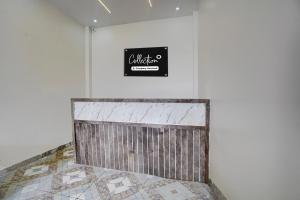 Giường trong phòng chung tại Super Collection O IIT BHU Varanasi Formerly Singh Residency +22 ảnh