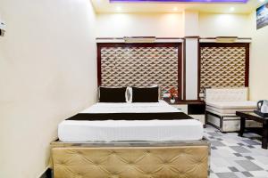 Postel nebo postele na pokoji v ubytování Super Hotel O NIT Durgapur Formerly Royal Inn