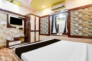 Postel nebo postele na pokoji v ubytování Super Hotel O NIT Durgapur Formerly Royal Inn + 26 fotografií