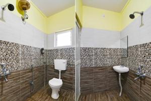 Ένα μπάνιο στο Super Hotel O Birsa Athletics Stadium Formerly De Anmol Suites