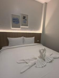 Ένα ή περισσότερα κρεβάτια σε δωμάτιο στο Soft Blue Home, Krabi Town