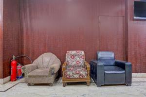 a group of chairs sitting in a room at Super Collection O Chhapra Railway Junction Formerly Hotel City Palace in Chupra