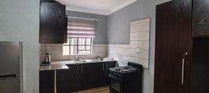 Køkken eller tekøkken på BlueHill Residence