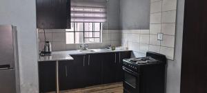 Køkken eller tekøkken på BlueHill Residence