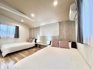 Кровать или кровати в номере Ichigayayanagichō 牛込柳町一户建-SJ0186