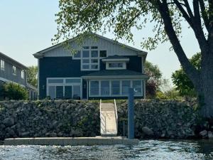 a house on the shore of a body of water at Mississippi waterfront getaway-Dogs Welcome! in Brownsville