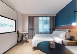 Ένα ή περισσότερα κρεβάτια σε δωμάτιο στο Hello Hotel Shenzhen Luohu Guomao Subway Station +13 φωτογραφίες