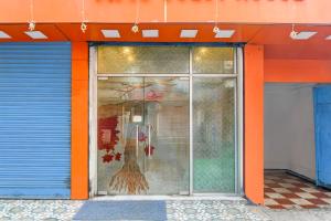 Fotografie z fotogalerie ubytování Collection O by OYO NSCB International Airport Formerly Raj Guest House v destinaci Kalkata + 23 fotografií