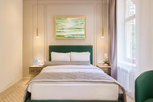 Ένα ή περισσότερα κρεβάτια σε δωμάτιο στο Maestro Address Baku Hotel