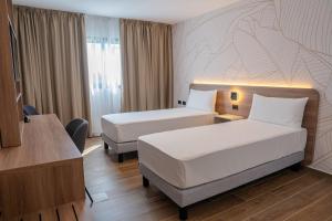 Ένα ή περισσότερα κρεβάτια σε δωμάτιο στο Days Inn by Wyndham Juan Dolio