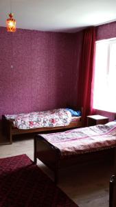 Postel nebo postele na pokoji v ubytování Guesthouse Robinzon Lalkhori