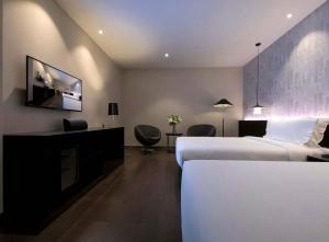 TV a/nebo společenská místnost v ubytování Orange Hotel Hangzhou Binjiang University Town