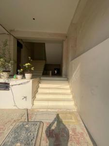 a building with stairs in the middle of a building at Luxury Heaven Hostel for students, parents and guests in Chaheru