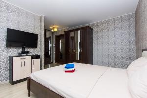 Postel nebo postele na pokoji v ubytování ApartLux 1905 goda Suite