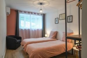 Postel nebo postele na pokoji v ubytování Charmante maison à Saint Béron