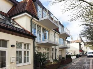 a house with balconies on the side of it at Fewo Jule in Norderney