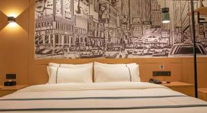 Ένα ή περισσότερα κρεβάτια σε δωμάτιο στο City Comfort Inn Wuhan Jianghan Road Xunlimen Metro Station +159 φωτογραφίες