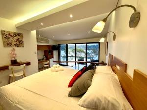 a bedroom with a large bed with two pillows at BlueWater Penthouse GuestSuite 2 in Newport